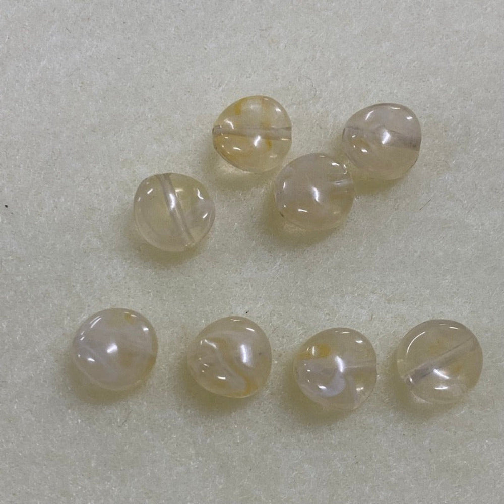 Citrine yellow gemstone style acrylic beads resembling real gemstones, with visible threading holes for crafting jewelry on a white background, used for crafting and jewelry making.