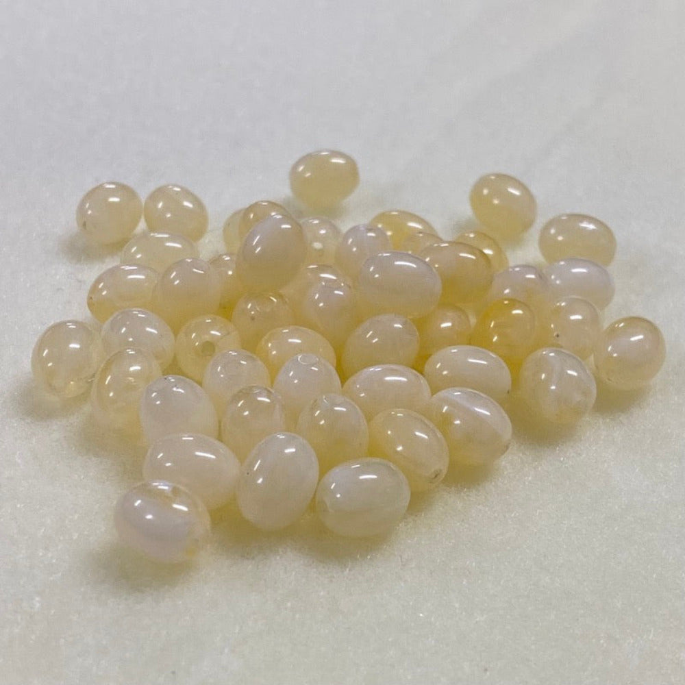 Citrine yellow gemstone style acrylic beads resembling real gemstones, with visible threading holes for crafting jewelry on a white background, used for crafting and jewelry making.