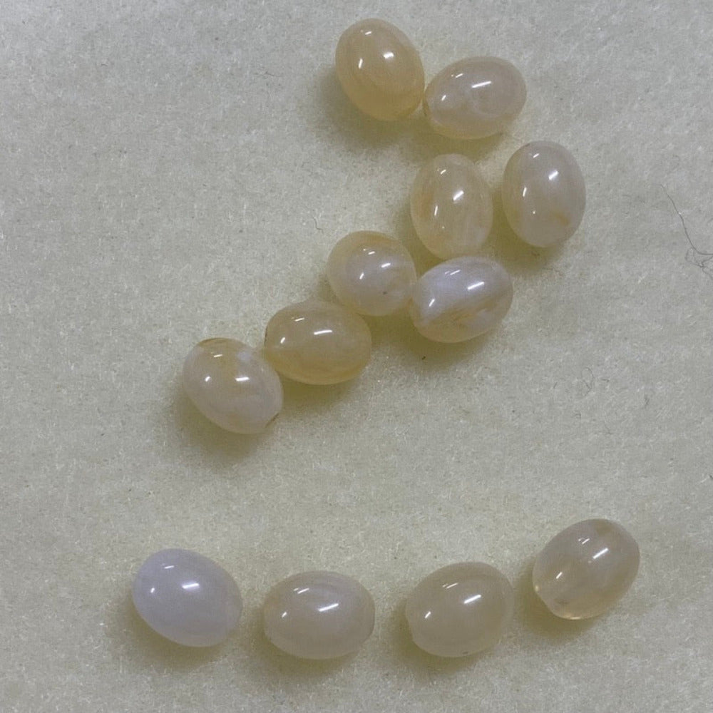 Citrine yellow gemstone style acrylic beads resembling real gemstones, with visible threading holes for crafting jewelry on a white background, used for crafting and jewelry making.
