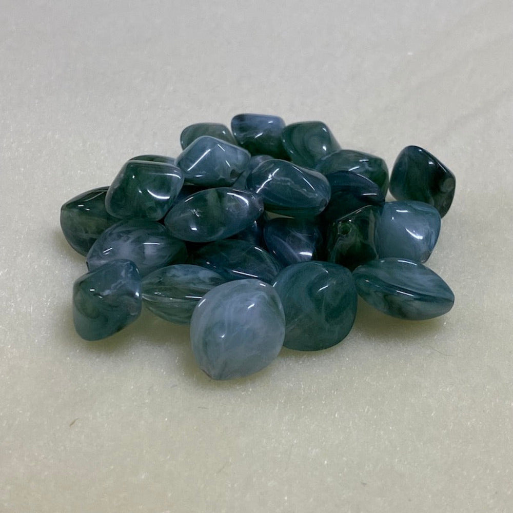 Jade green gemstone style acrylic beads with visible threading holes for crafting jewelry on a white background