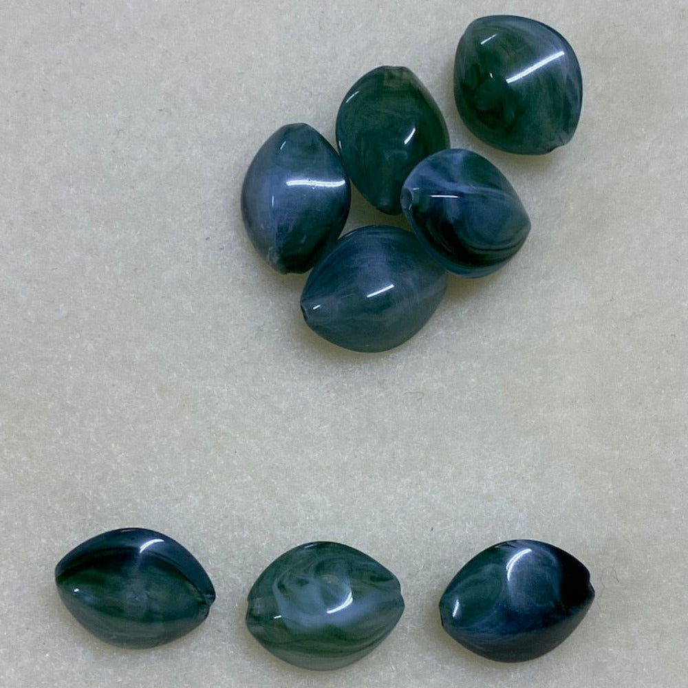 Jade green gemstone style acrylic beads with visible threading holes for crafting jewelry on a white background