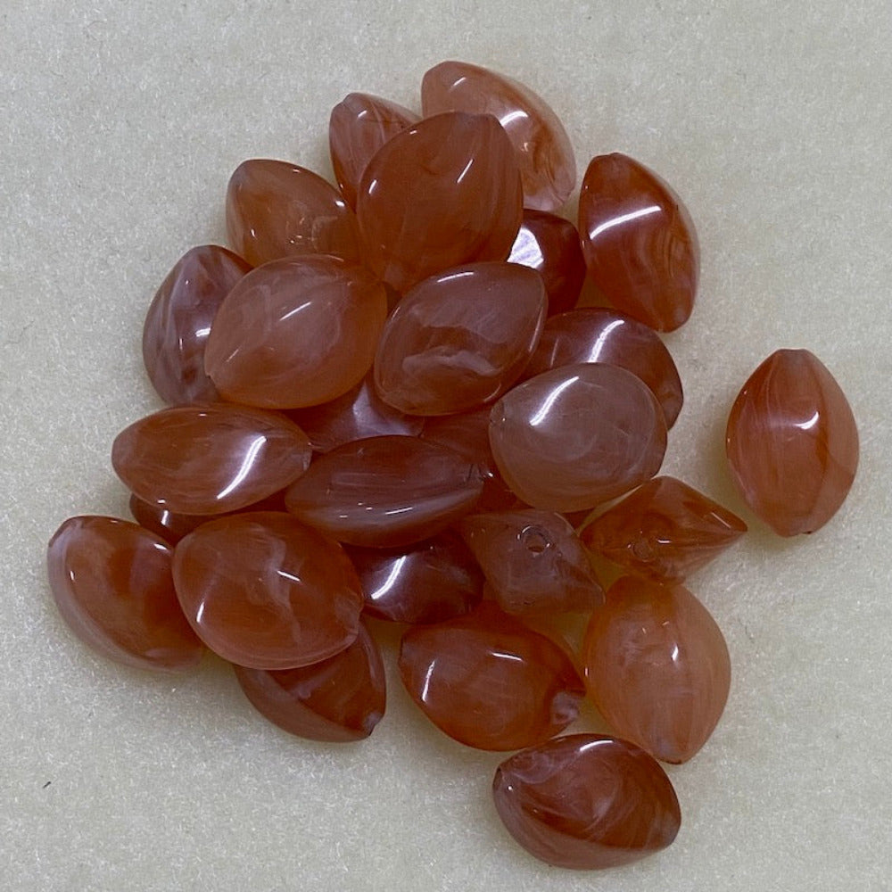 Carnelian orange gemstone style acrylic beads resembling real gemstones, with visible threading holes for crafting jewelry on a white background, used for crafting and jewelry making.