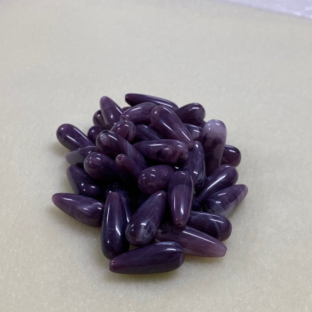 Amethyst purple gemstone style acrylic beads resembling real gemstones, with visible threading holes for crafting jewelry on a white background, used for crafting and jewelry making.