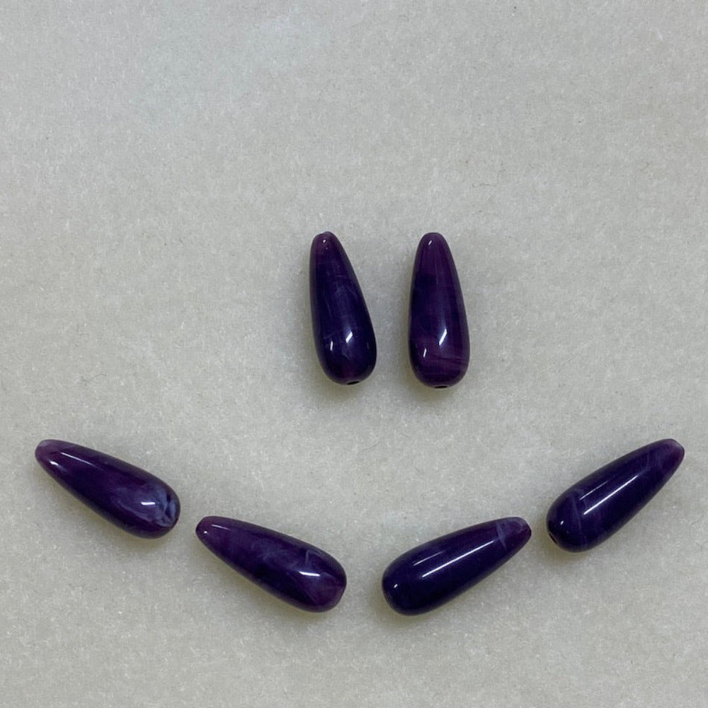 Amethyst purple gemstone style acrylic beads resembling real gemstones, with visible threading holes for crafting jewelry on a white background, used for crafting and jewelry making.