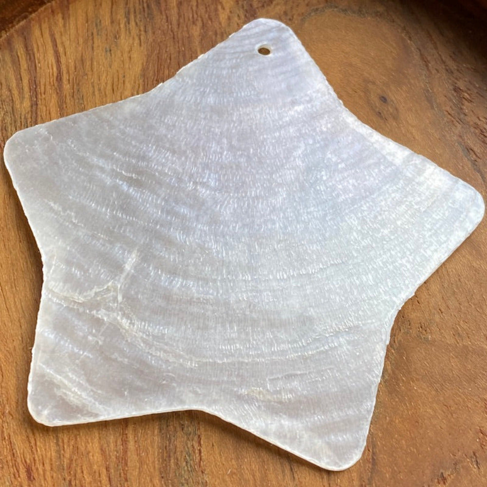 star shape capiz shell for the purpose of hanging decoration, christmas and craft and decor with one holesdrilled