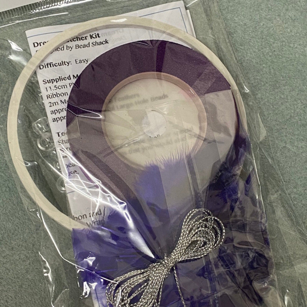 close up photo of a packed kit with written instructions showing colours of items inside the clear cellophane bag