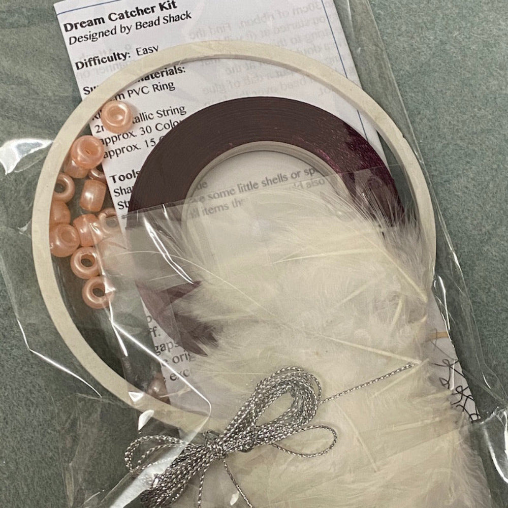 close up photo of a packed kit with written instructions showing colours of items inside the clear cellophane bag