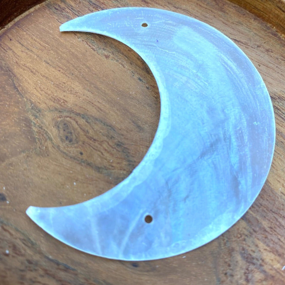 Moon shape capiz shell for the purpose of hanging decoration craft and decor with two holes drilled