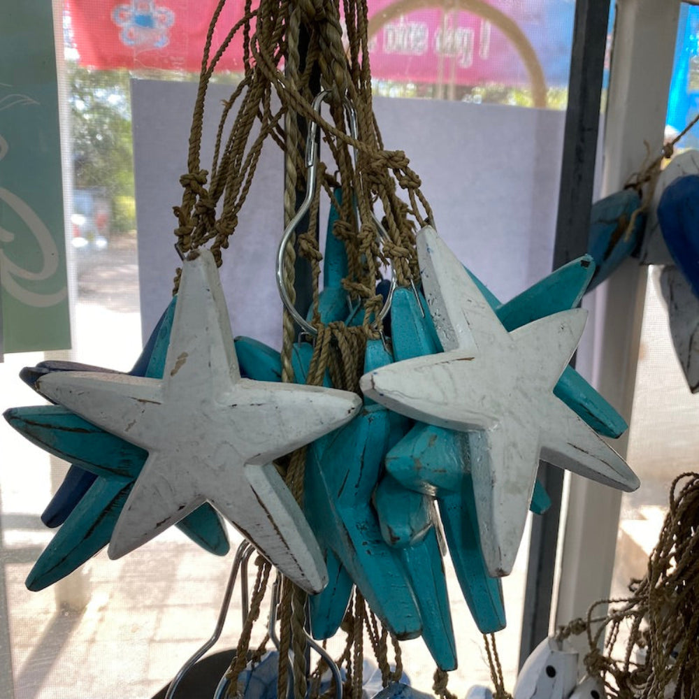 Wood blue and white star decorations in a shop window