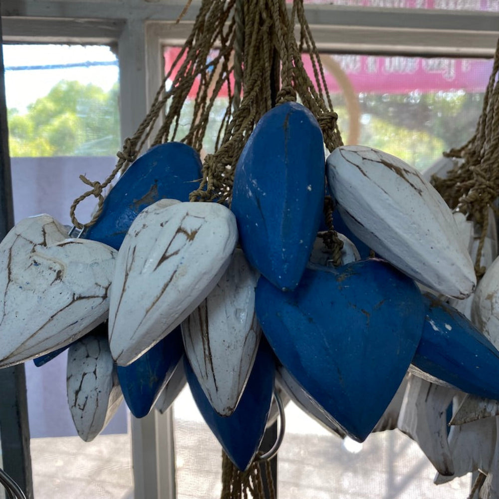 Wood blue and white heart decorations in a shop window