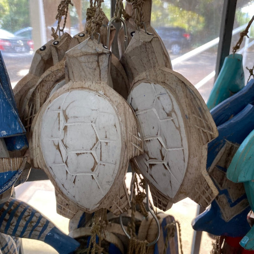 Wood white turtles decorations in a shop window