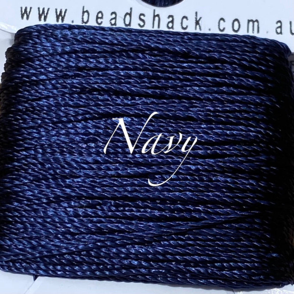 A close up photo of silky thread showing the textured surface used for the purpose of sewing craft and jewelry stringing