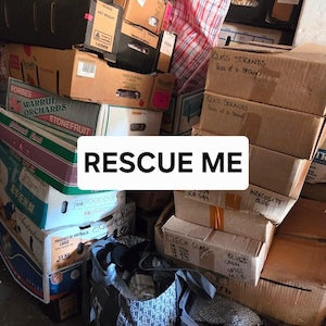 a pile of old boxes full of beads and a sign across the front saying Rescue Me.  The great bead rescue campaign has started at Bead Shack