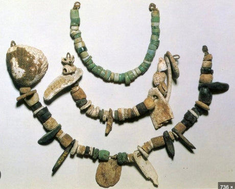 Great examples of very old prehistoric jewelry showing stones seeds shells and more