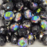 Multicolored faceted beads on a white background