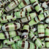 Striped candy look beads with green, brown, and white colors.