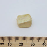 rectangular cream marble look bead on a white background with a ruler to show scale