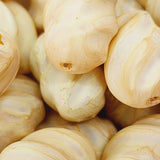 Close-up of marble finish wood look beads with a central hole.