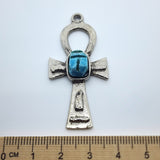 A vintage Egyptian ankh-shaped pendant charm with a scarab feature, handcrafted from faience, displayed against a white background with a measuring ruler at the bottom.