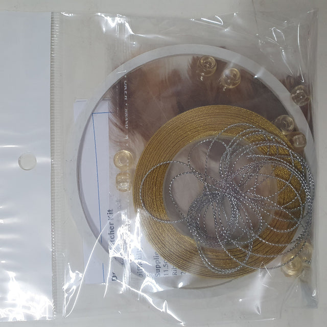 close up photo of a packed kit showing colours of items inside the clear cellophane bag