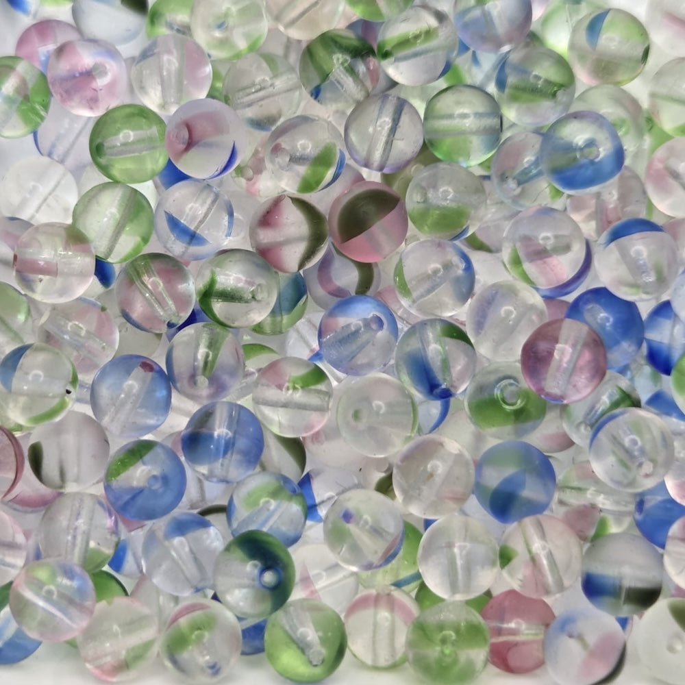 clear colored beads on a white background