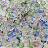 clear colored beads on a white background