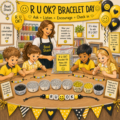 Illustrated scene of a group of children and a woman making beaded bracelets at a table, with large signs reading 'RU OK? Bracelet Day' and product labels for elastic, red, yellow, and black beads. This is not a clean product shot and not a real photographed environment; it functions as a promotional/educational graphic, so subject_type is best classified as Other rather than Lifestyle or Product/Packaging.