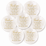 Seven round white shell name place cards with gold engraved text reading 'Thank you for sharing our special day 8-6-25 Mr. and Mrs.