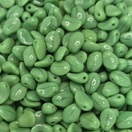 Close-up of green LEAF SHAPE beads with a glossy finish