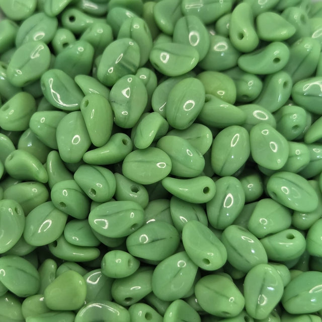 Close-up of green LEAF SHAPE beads with a glossy finish