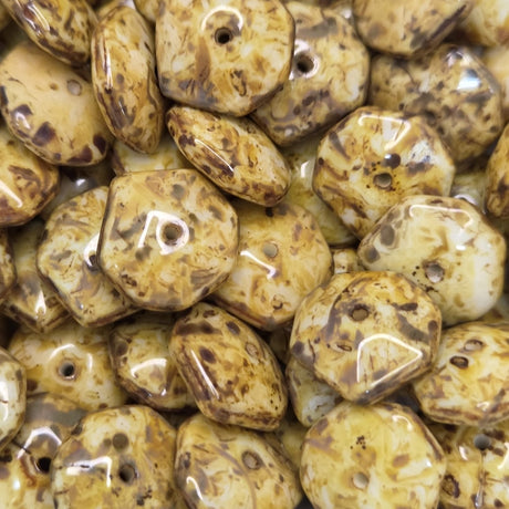 Close-up of brown and beige beads with glossy surface