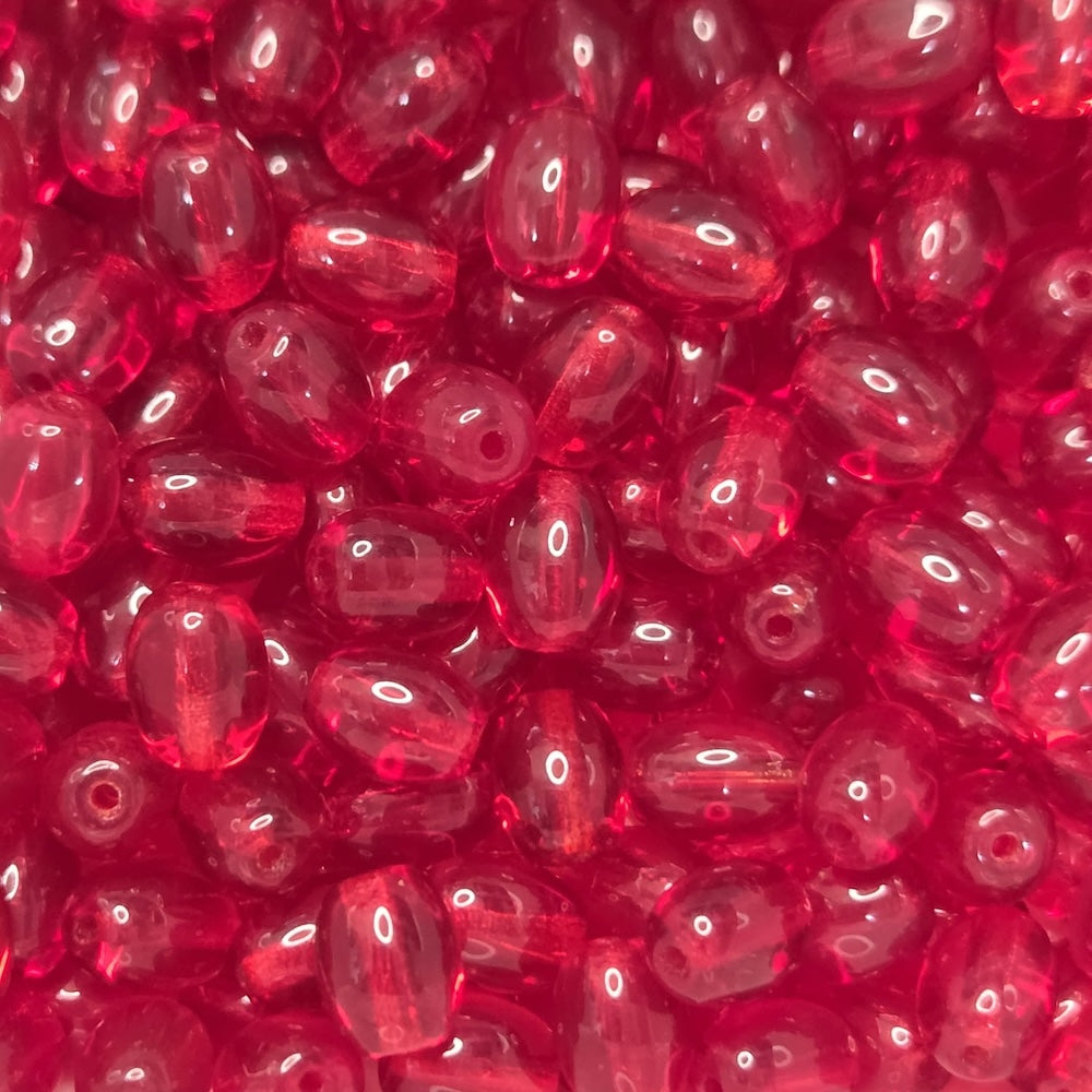Close-up of red transparent oval beads