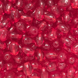 Close-up of red transparent oval beads