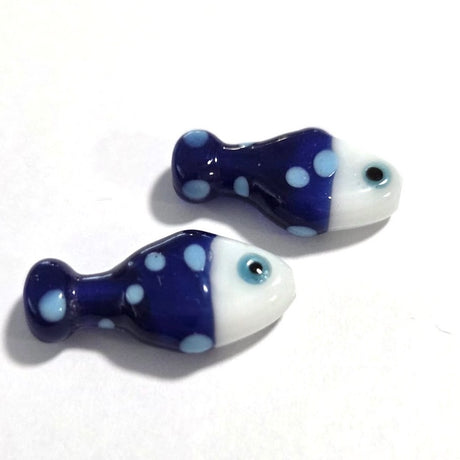 bright blue fish ceramic beads with light blue spots on a white surface