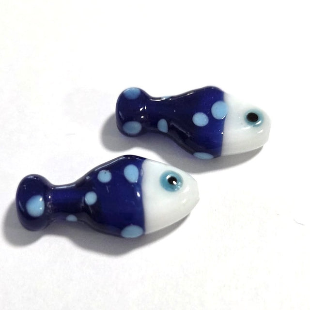 bright blue fish ceramic beads with light blue spots on a white surface