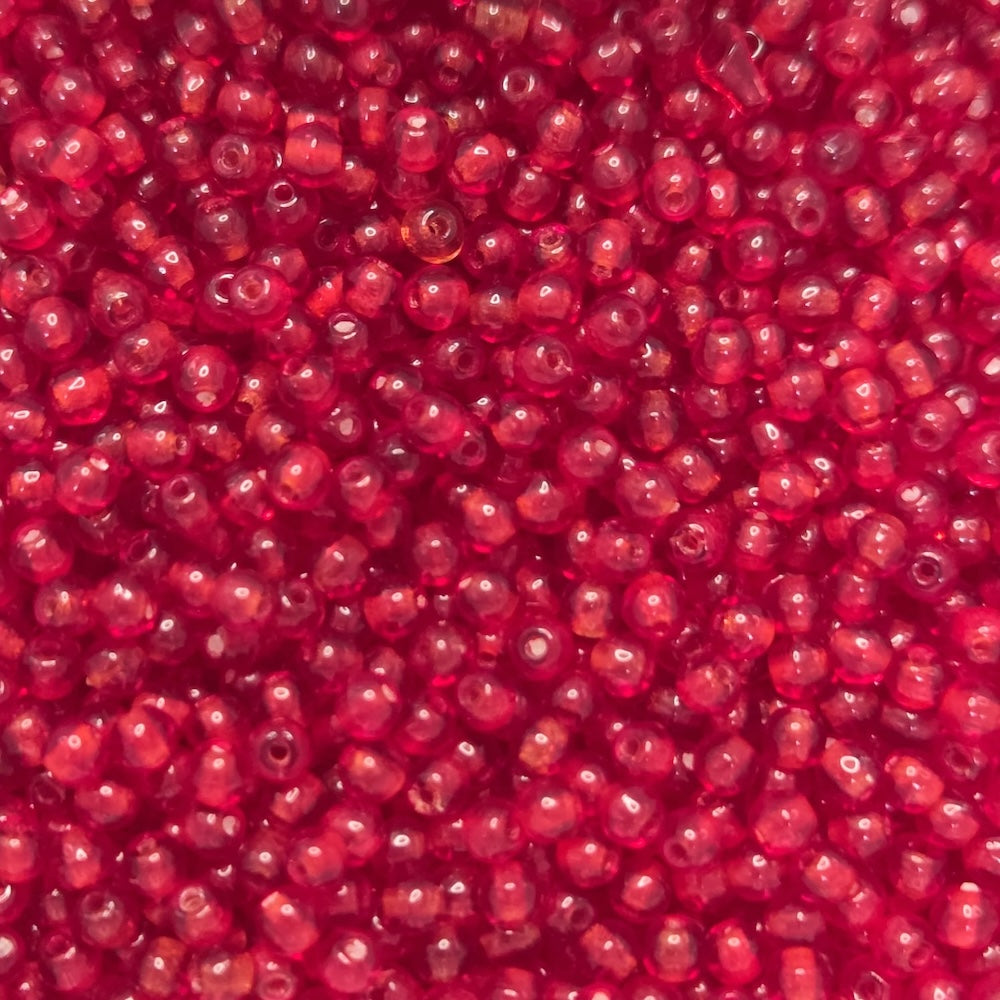 Close-up of tiny round 3mm red glass beads