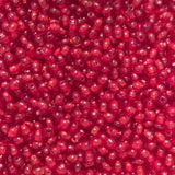 Close-up of tiny round 3mm red glass beads