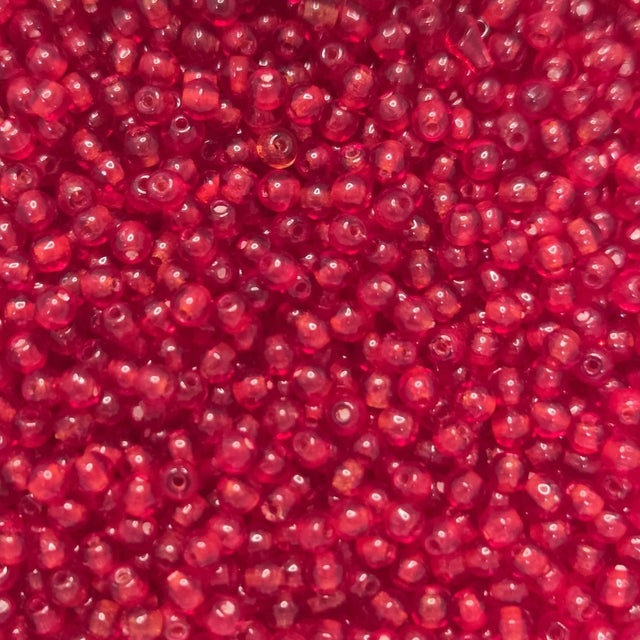 Close-up of tiny round 3mm red glass beads