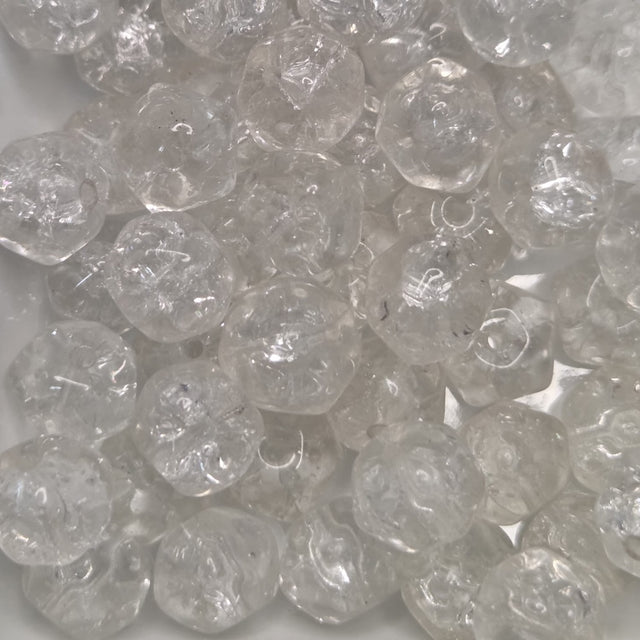 Close-up of clear crackle effect glass beads on a white background