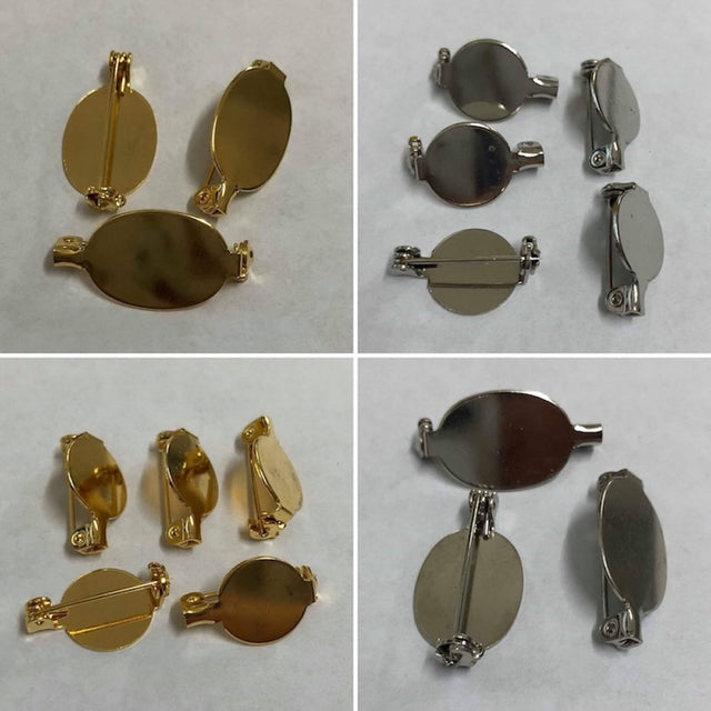 Gold and silver brooch making components on a white background