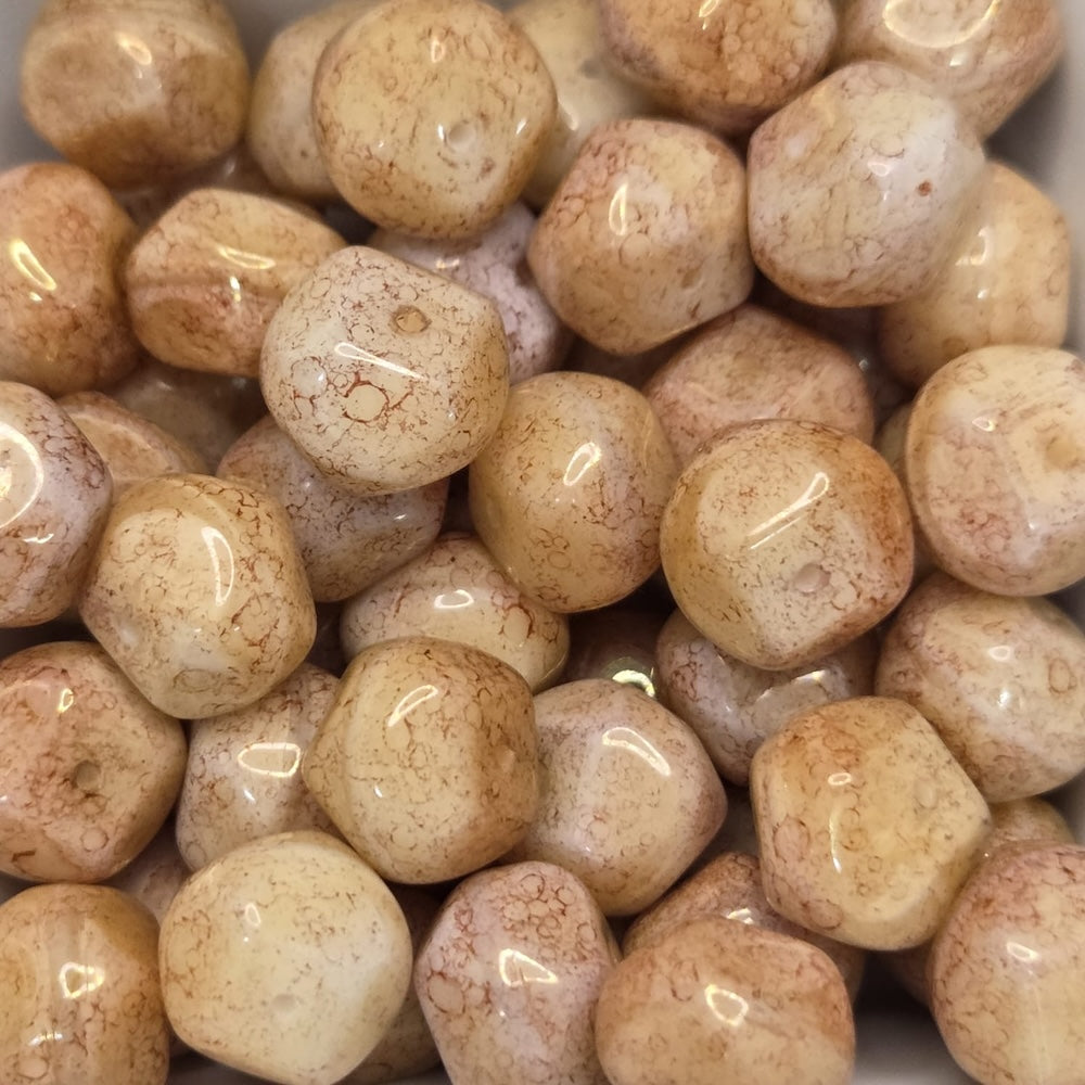 Close-up of beige beads with a glossy finish