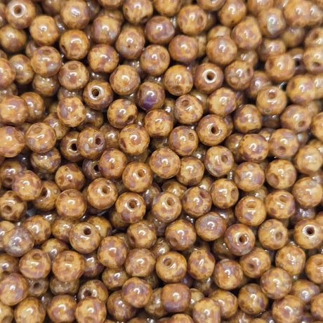 Close-up of brown beads with a speckled pattern
