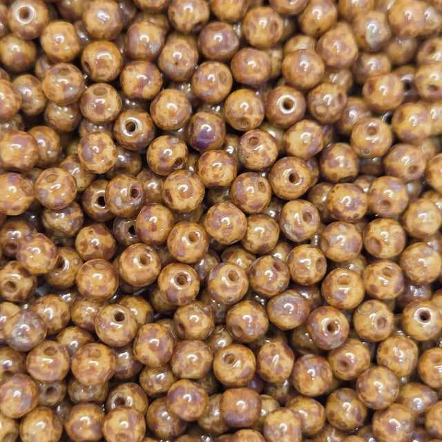 Close-up of brown beads with a speckled pattern