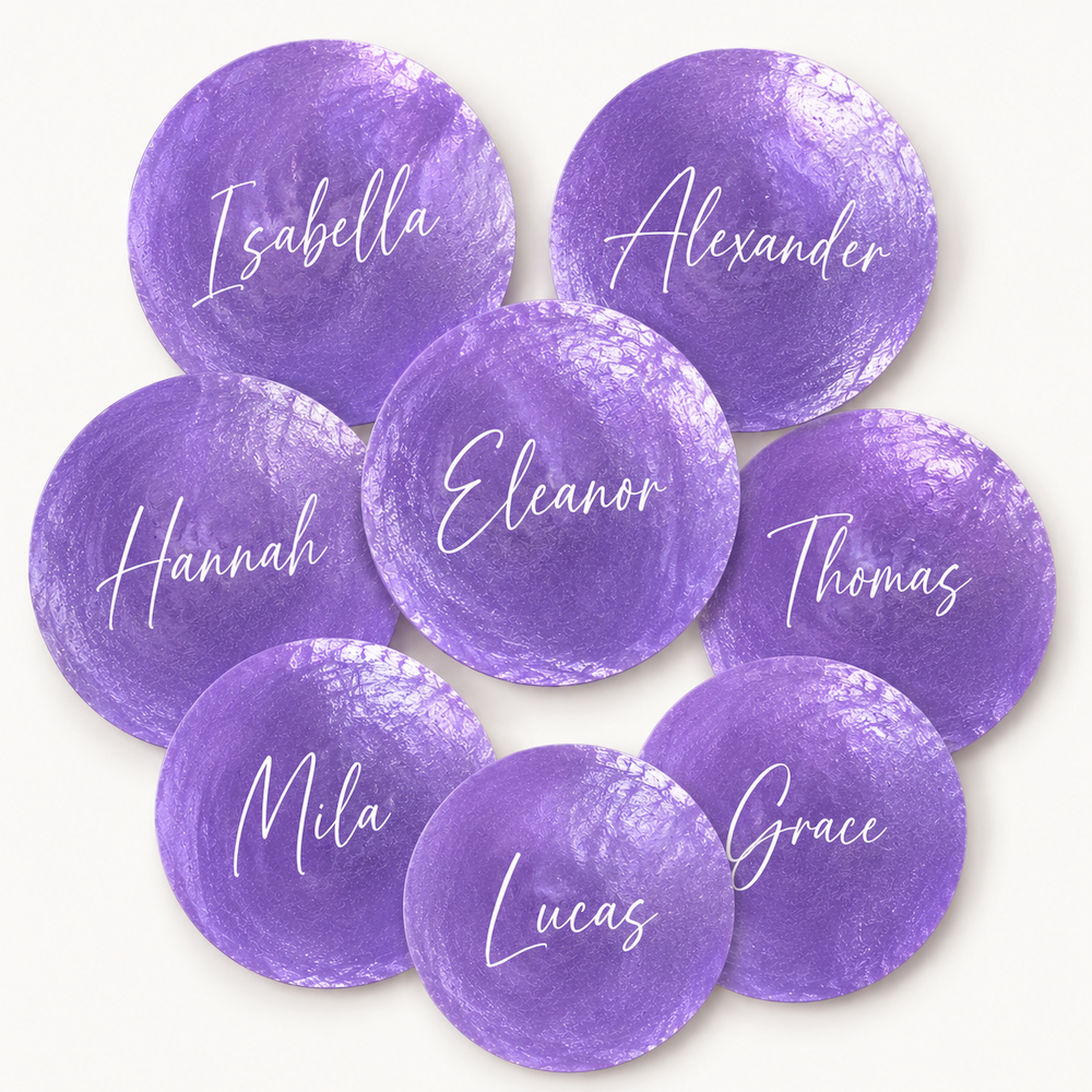 Eight circular purple watercolor-style shell nameplates with white script names, arranged in a cluster on a light cream background.
