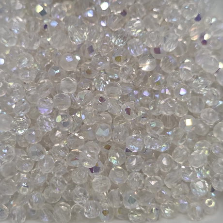 Close-up of clear fire polish beads with a sparkling effect