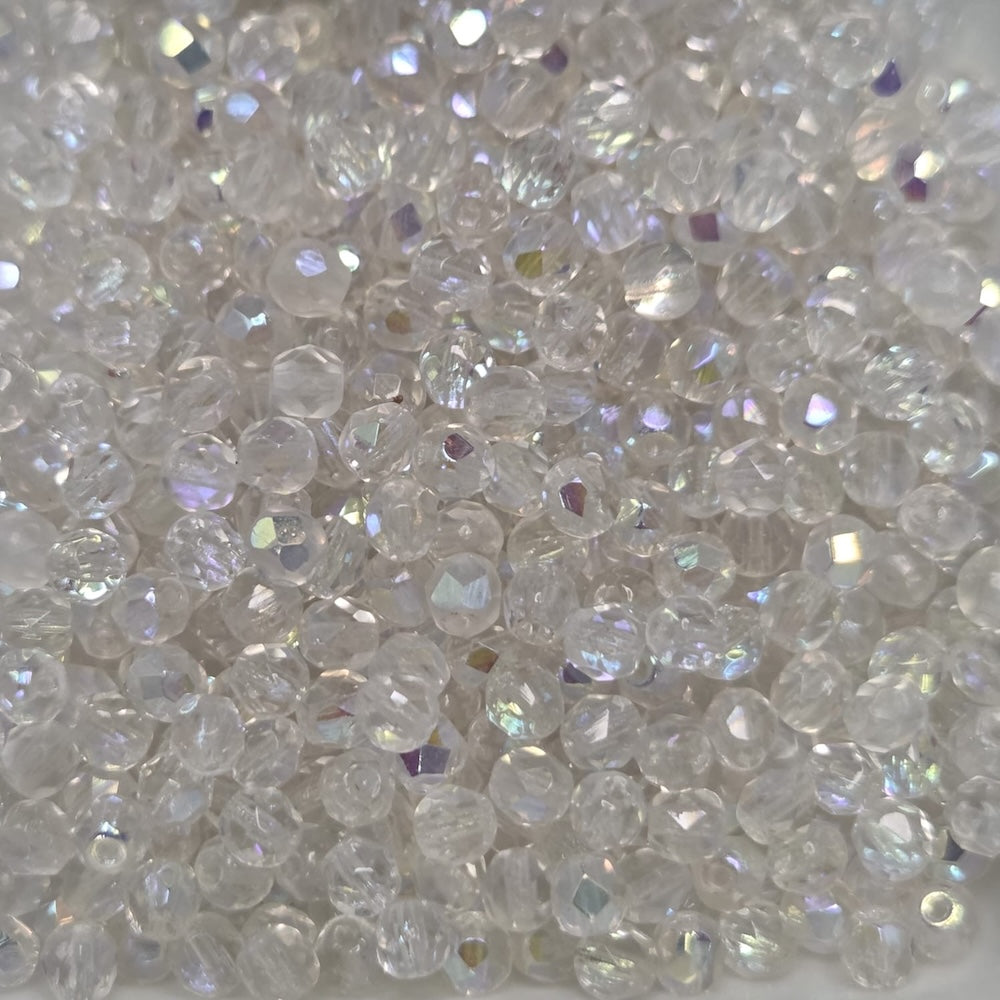 Close-up of clear fire polish beads with a sparkling effect