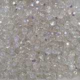 Close-up of clear fire polish beads with a sparkling effect