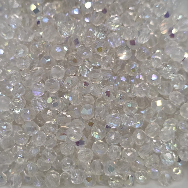 Close-up of clear fire polish beads with a sparkling effect