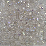 Close-up of clear fire polish beads with a sparkling effect