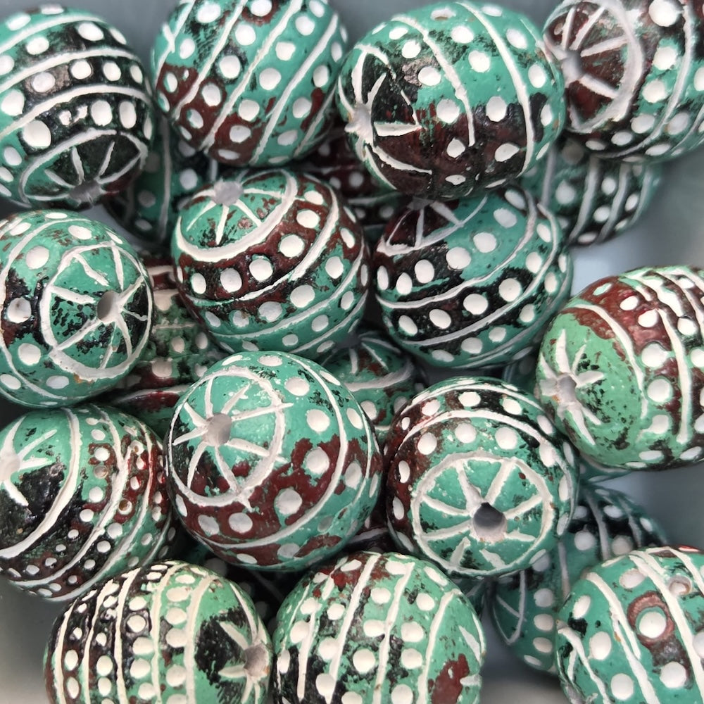 vintage green carved clay beads with visible threading holes for making jewelry and craft